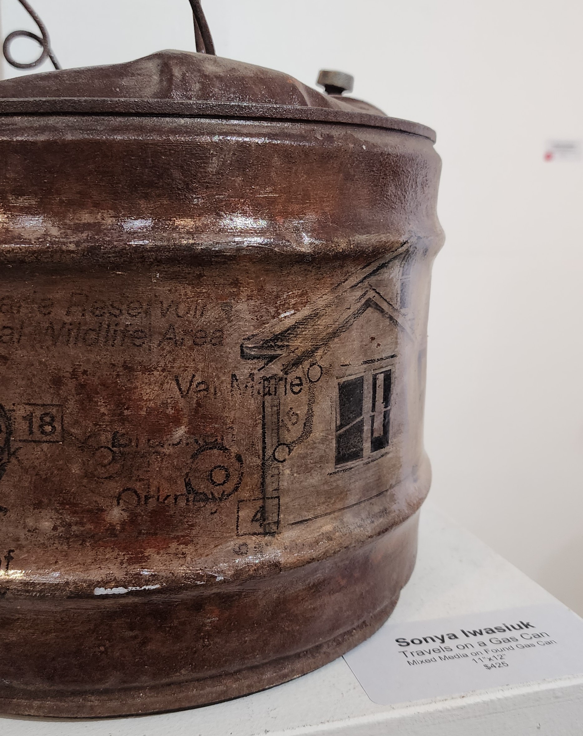 Close up of metal barrel with painting