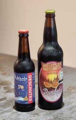 Bottles of deschute jubelale and whistler brewing dunkel
