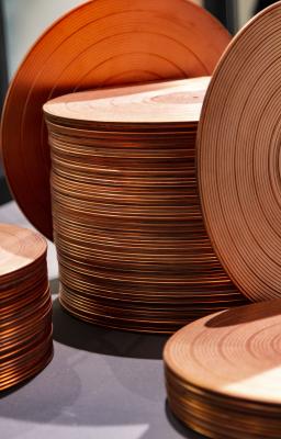 Stack of copper plates - art by Sonny Assu