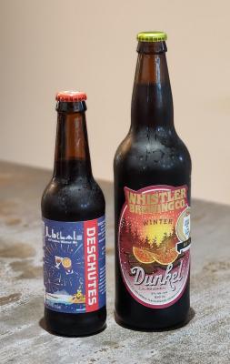 Bottles of deschute jubelale and whistler brewing dunkel