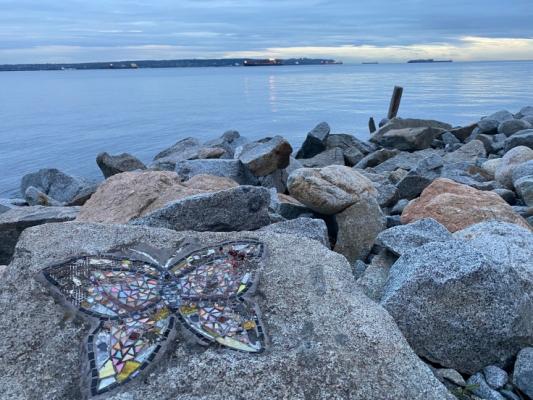 View over the sea with rocks in the foreground